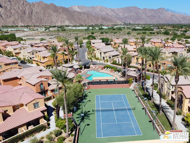 an aerial view of residential houses and outdoor space