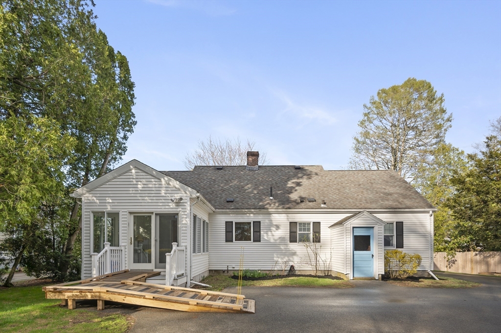 110 Linden Street Hamilton, MA 01982 - Photo 4 of 25 a front view of a house with a yard