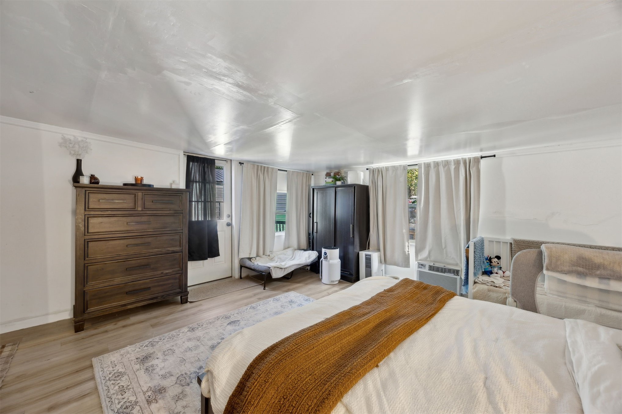 15461 Dewanna Road Jacksonville, FL 32218 - Photo 11 of 27 a bedroom with a bed and cabinets