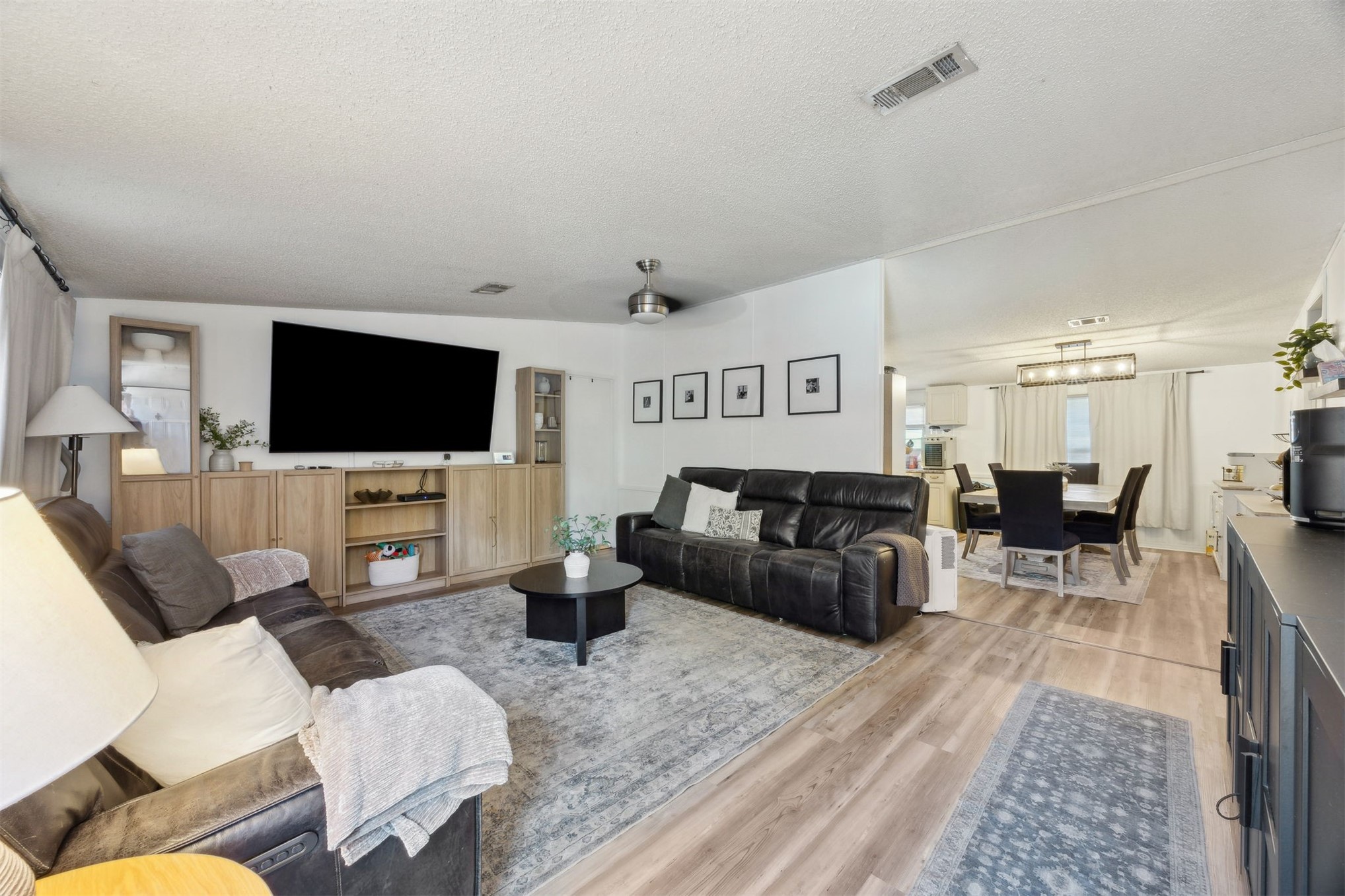 15461 Dewanna Road Jacksonville, FL 32218 - Photo 13 of 27 a living room with furniture and a flat screen tv