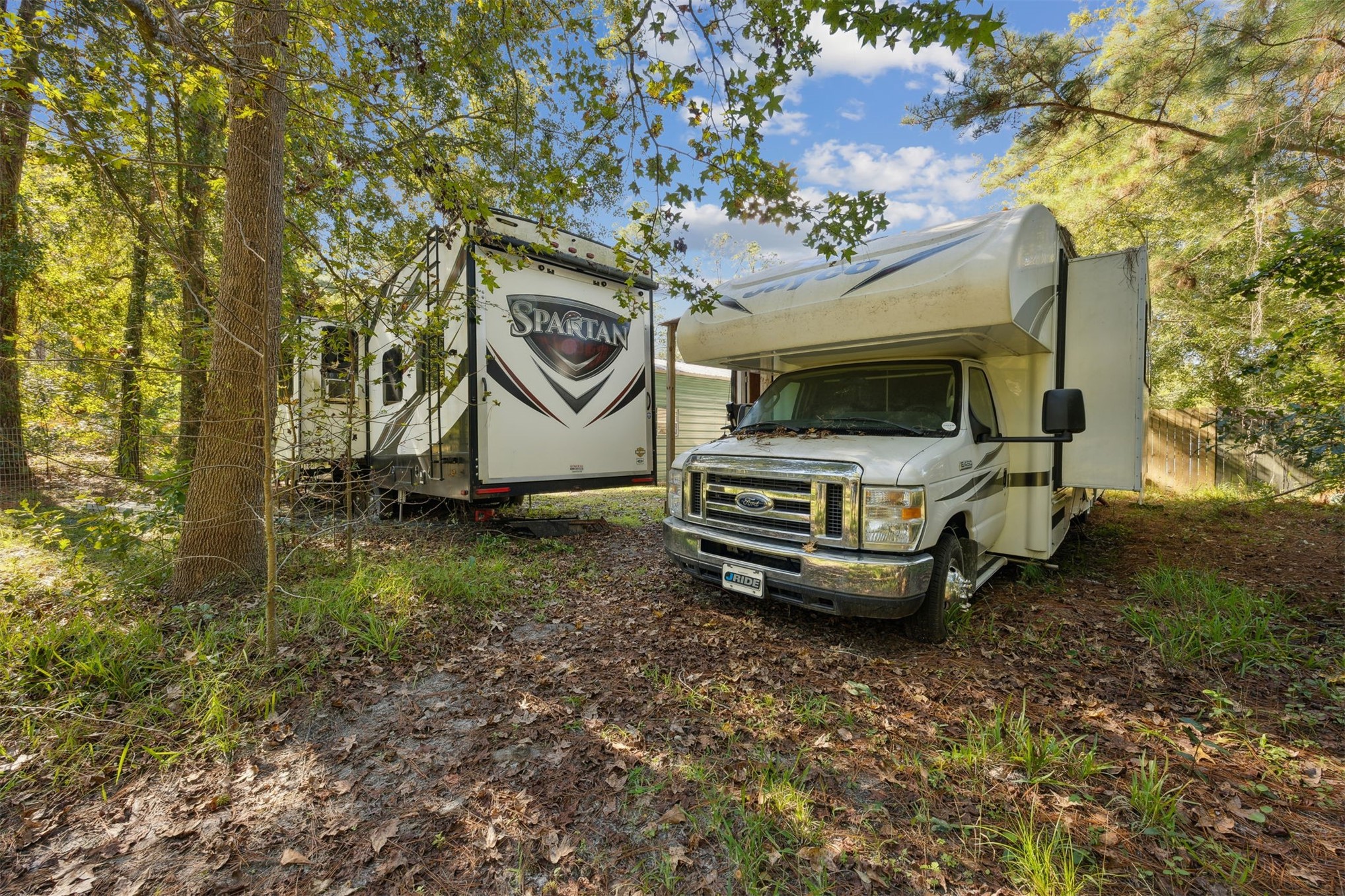 15461 Dewanna Road Jacksonville, FL 32218 - Photo 17 of 27 a view of a backyard with plants and large trees