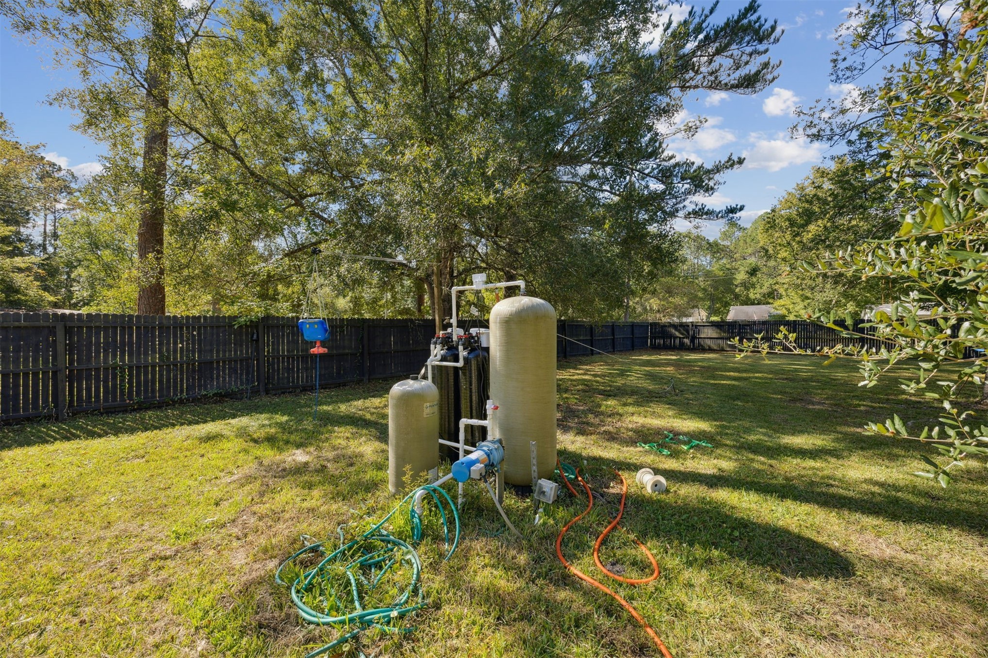 15461 Dewanna Road Jacksonville, FL 32218 - Photo 18 of 27 a backyard of a house with lots of green space and fountain
