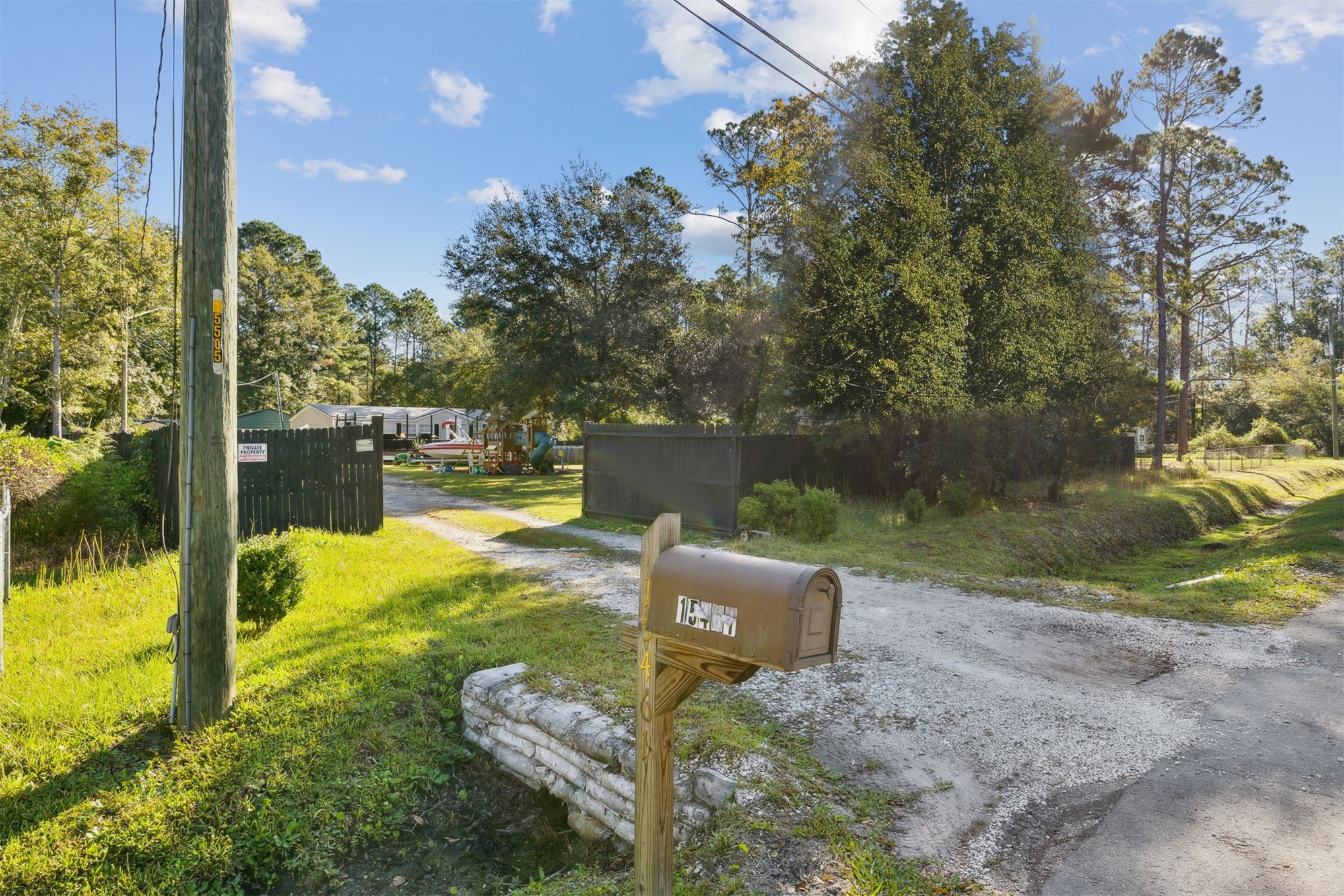 15461 Dewanna Road Jacksonville, FL 32218 - Photo 2 of 27 a view of a garden with a bench in the patio