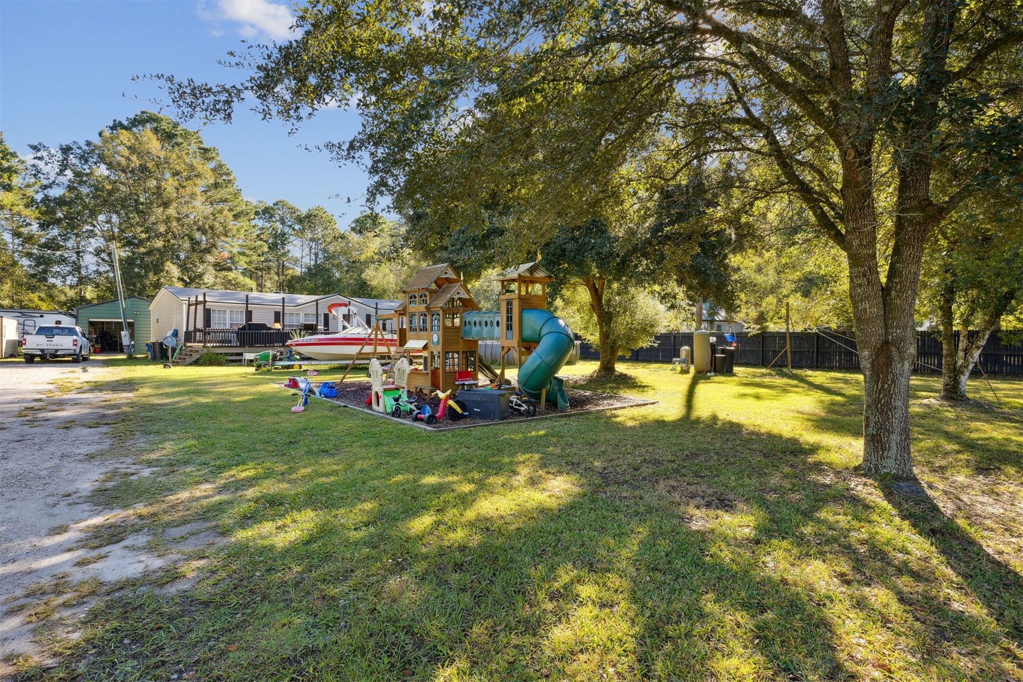 15461 Dewanna Road Jacksonville, FL 32218 - Photo 21 of 27 a view of yard with swimming pool and trees