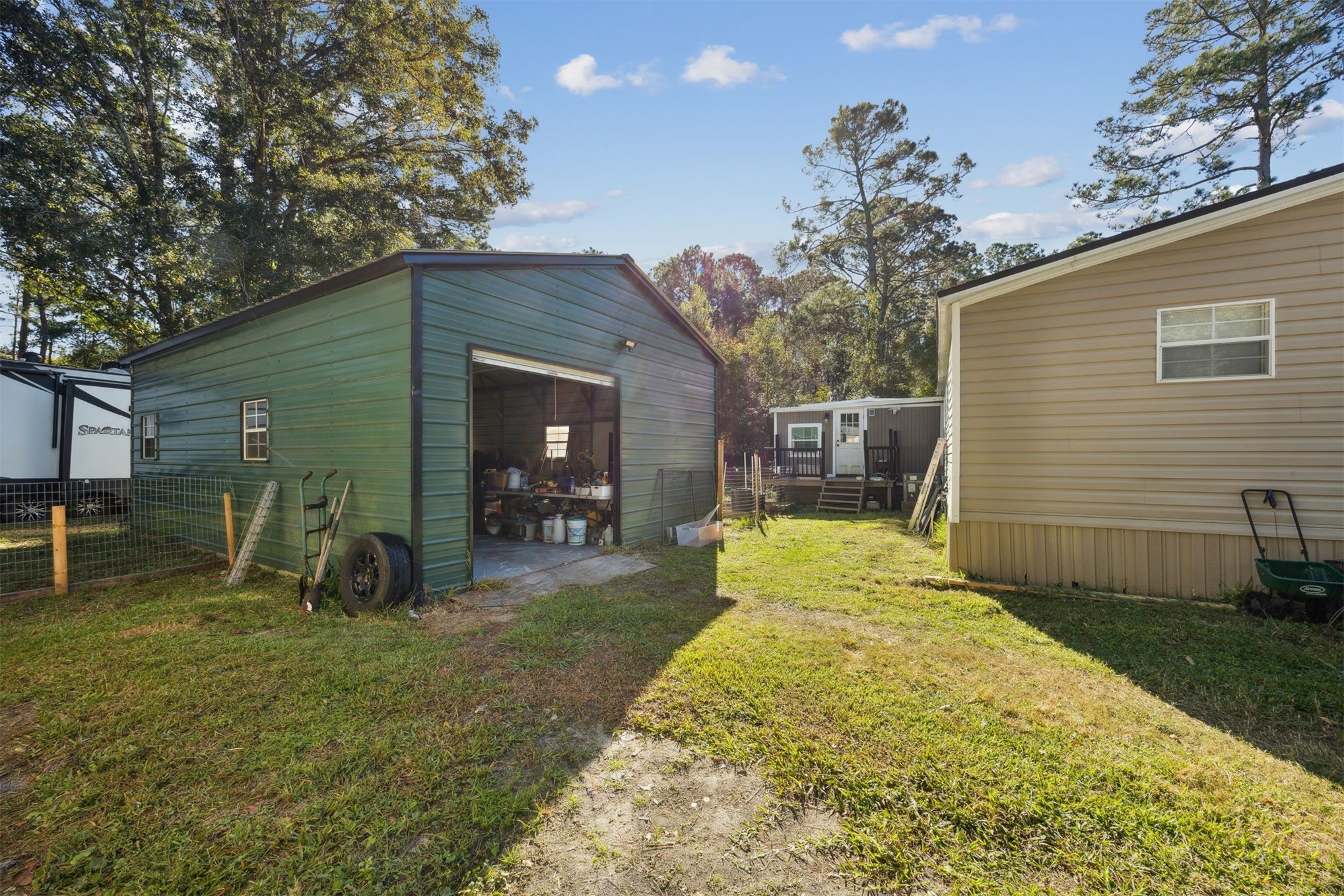 15461 Dewanna Road Jacksonville, FL 32218 - Photo 22 of 27 a view of a backyard with plants and a patio