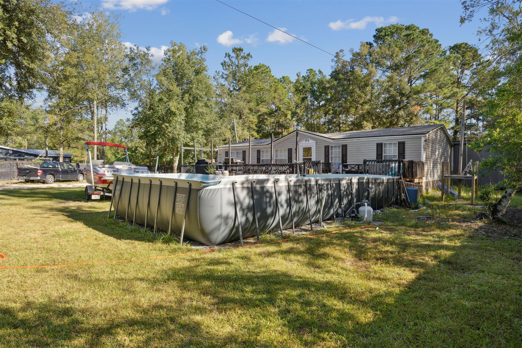 15461 Dewanna Road Jacksonville, FL 32218 - Photo 24 of 27 a view of a house with backyard and sitting area