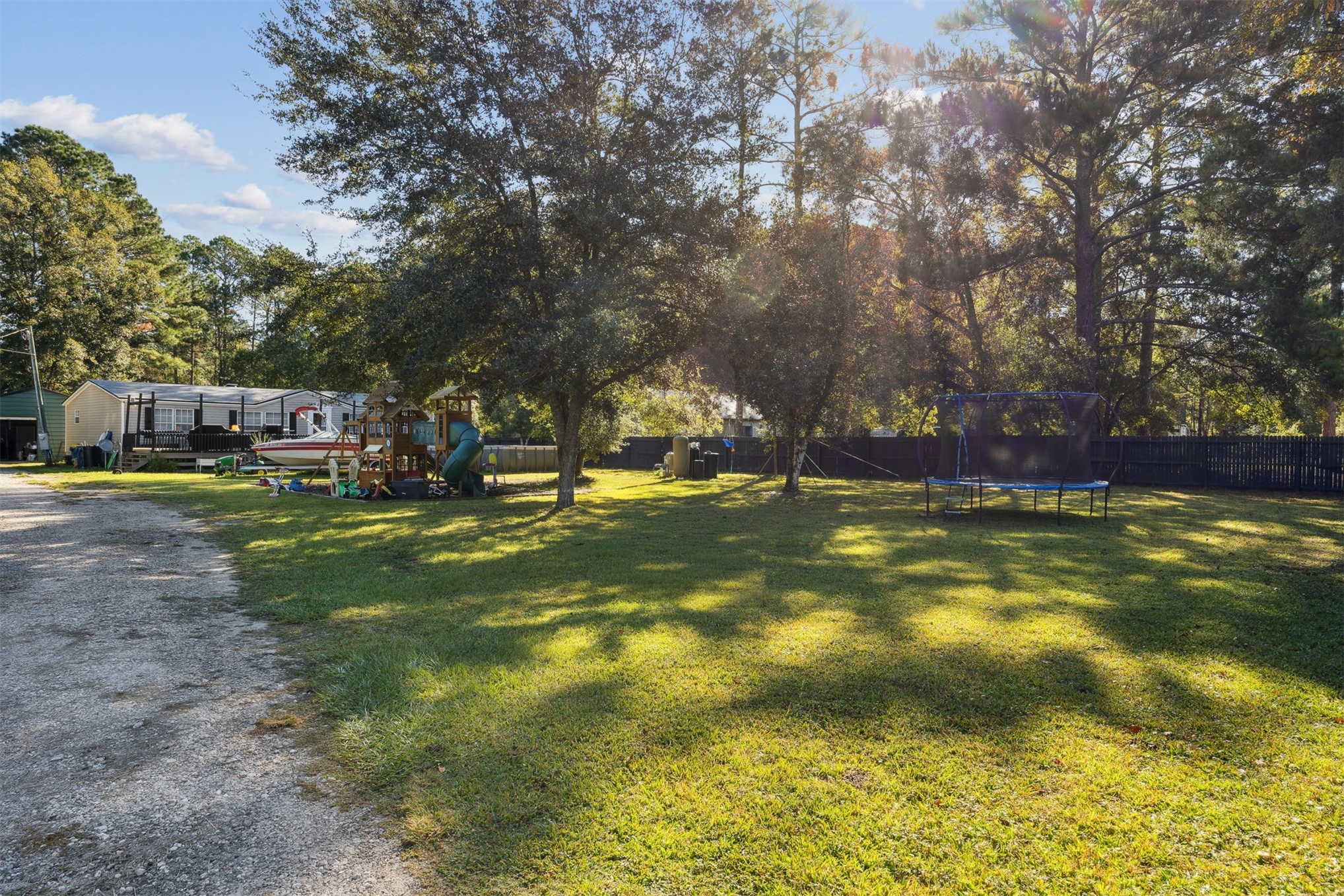 15461 Dewanna Road Jacksonville, FL 32218 - Photo 25 of 27 a view of yard with swimming pool and green space