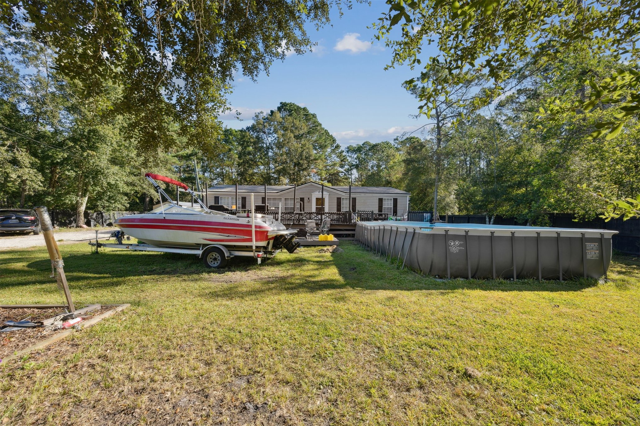 15461 Dewanna Road Jacksonville, FL 32218 - Photo 27 of 27 a view of a swimming pool with a table and chairs