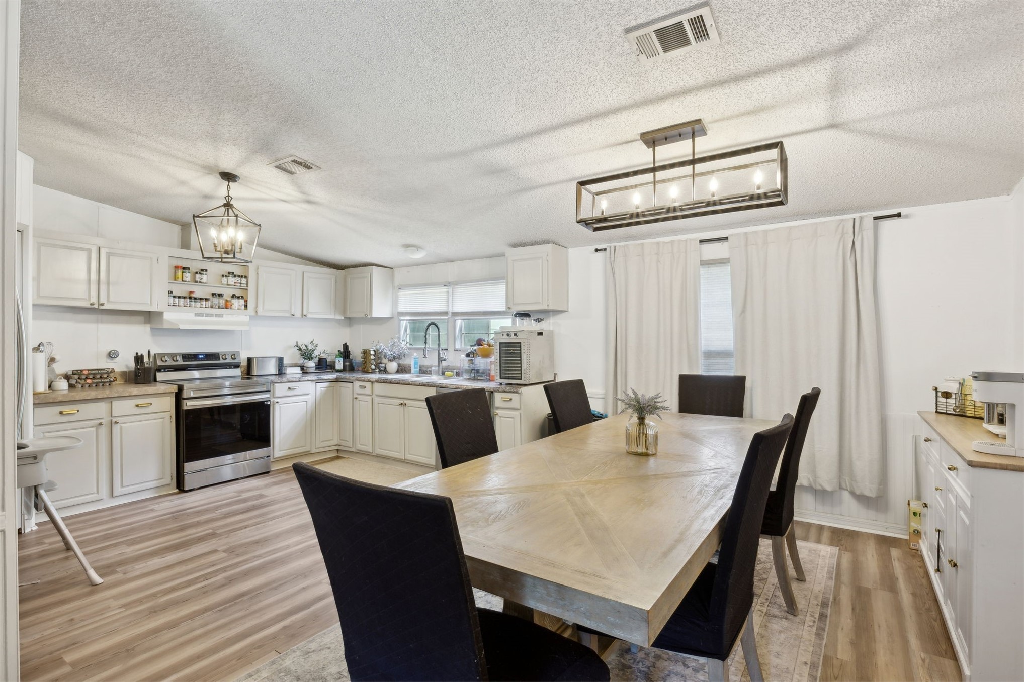15461 Dewanna Road Jacksonville, FL 32218 - Photo 6 of 27 a view of kitchen with cabinets and wooden floor