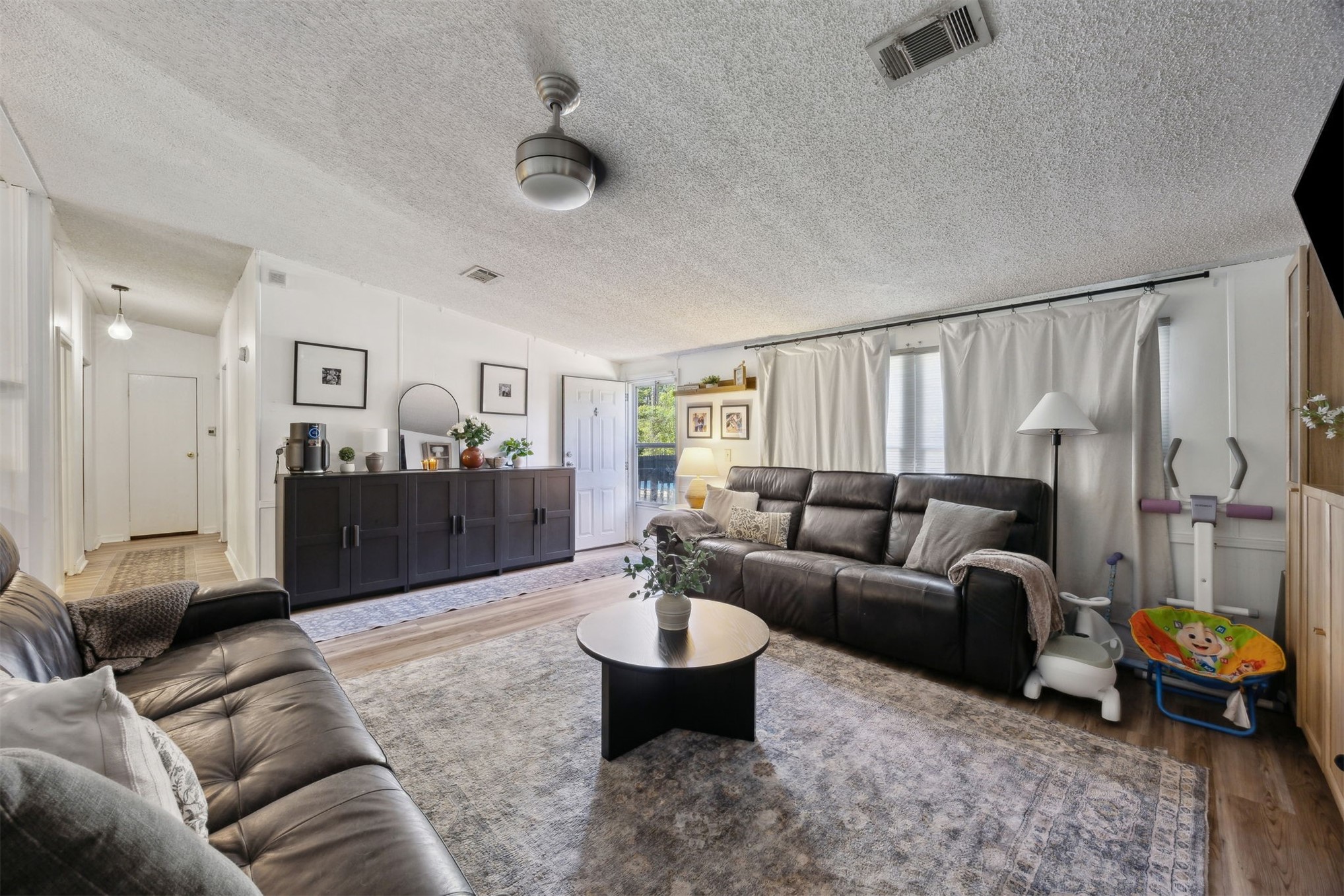 15461 Dewanna Road Jacksonville, FL 32218 - Photo 9 of 27 a living room with furniture and a large mirror