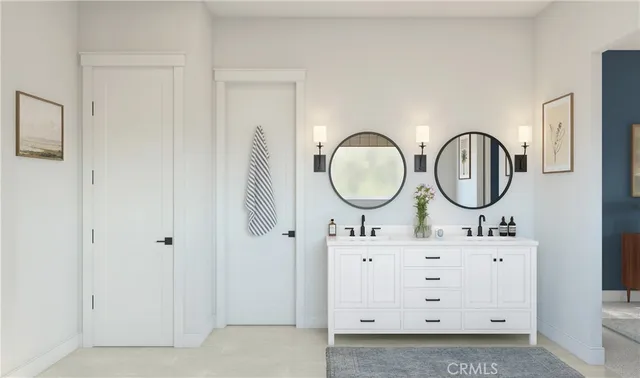 a bathroom with a mirror a sink and a mirror