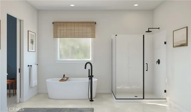 a bathroom with a tub and shower