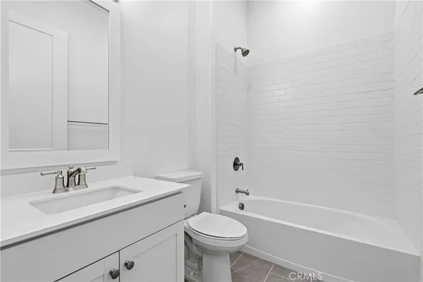 a bathroom with a sink toilet and a bathtub