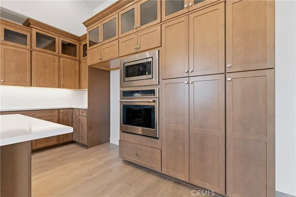 a kitchen with stainless steel appliances a refrigerator and cabinets