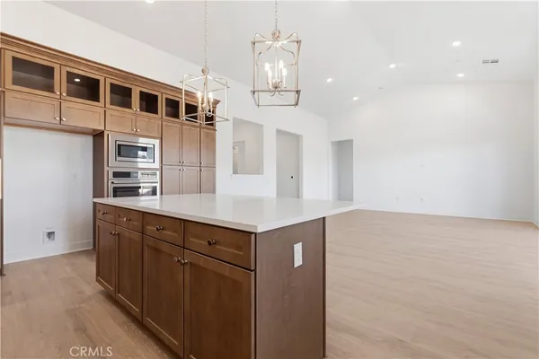 a kitchen with stainless steel appliances a sink and cabinets