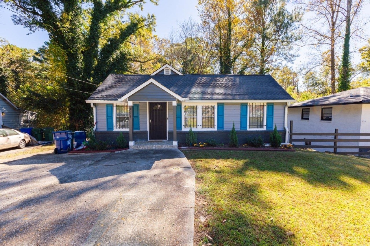 351 Fairburn Road Southwest Atlanta, GA 30331 - Photo 1 of 1 a house with swimming pool in front of it