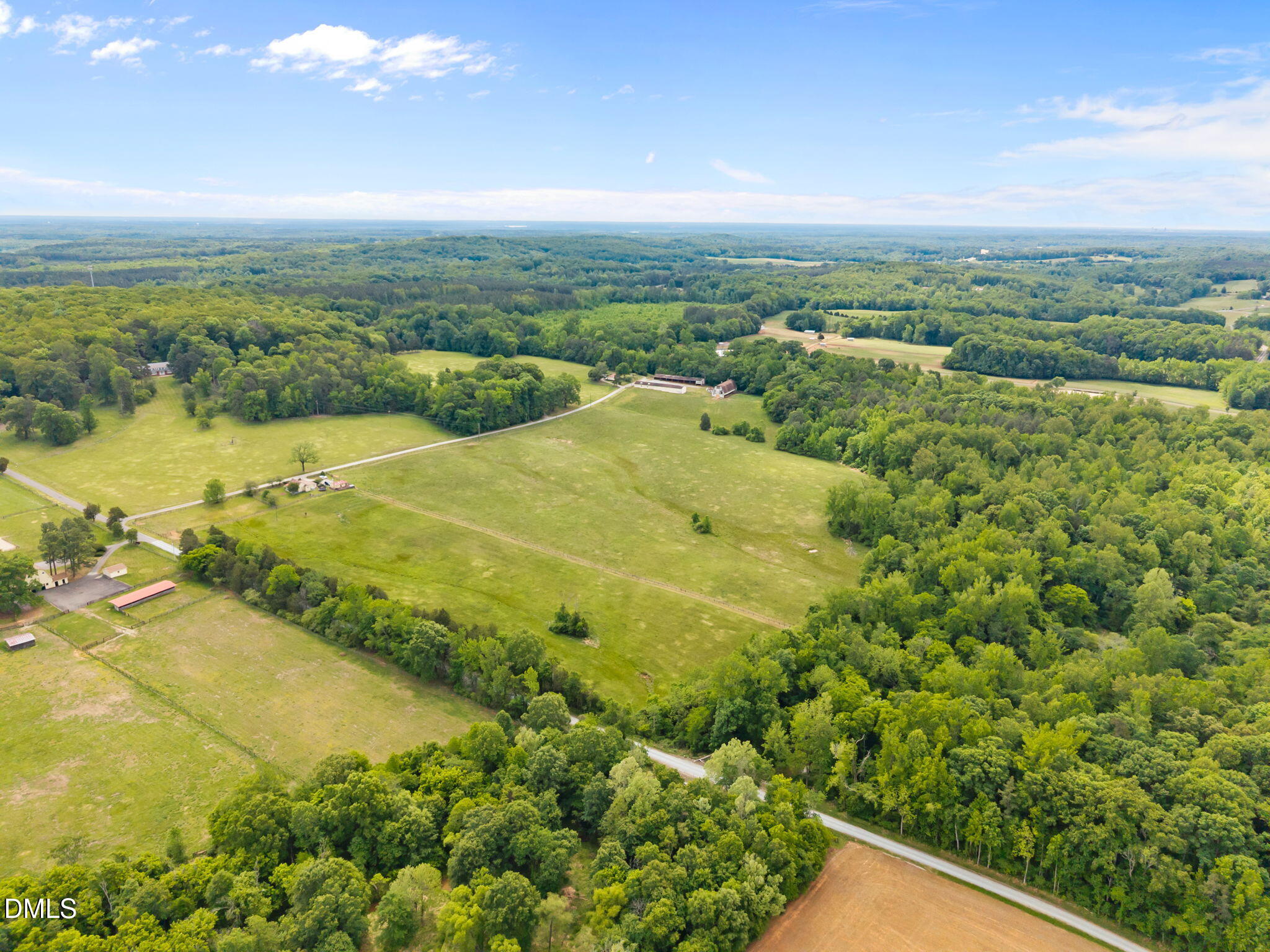 423 Quail Roost Farm Road Rougemont, NC 27572 - Photo 3 of 44 a view of a city with an ocean