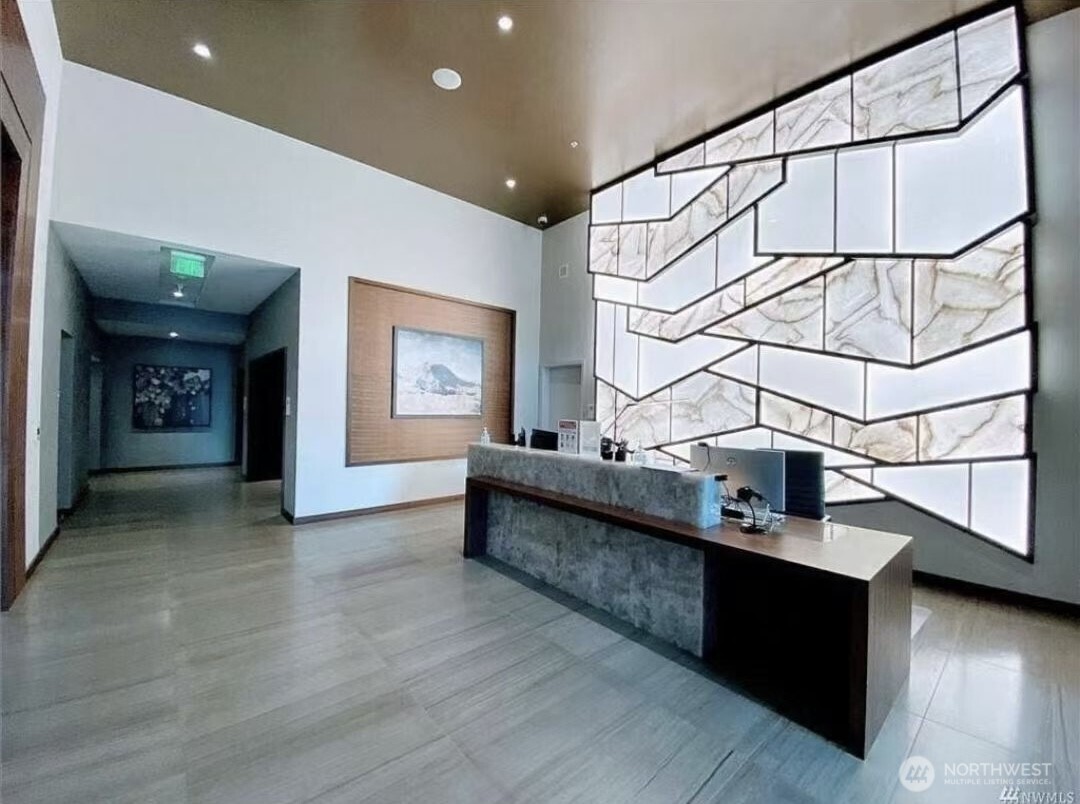 188 Bellevue Way Northeast, Unit 308 Bellevue, WA 98004 - Photo 4 of 19 a view of entryway and hall with wooden floor