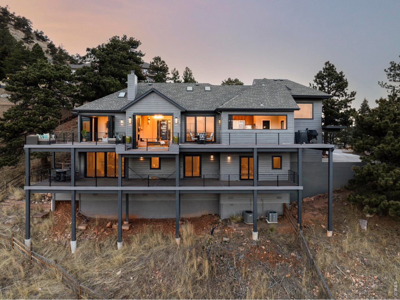 150 Valley View Way Boulder, CO 80304 - Photo 35 of 36 Extensive wrap-around decks span multiple levels with custom metal railings that preserve sightlines, creating true outdoor rooms accessible from nearly every space.