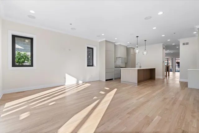 a bathroom with a double vanity sink mirror and shower