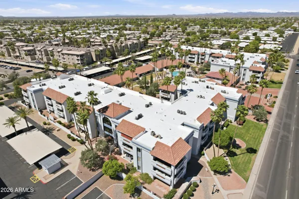 an aerial view of residential houses with outdoor space