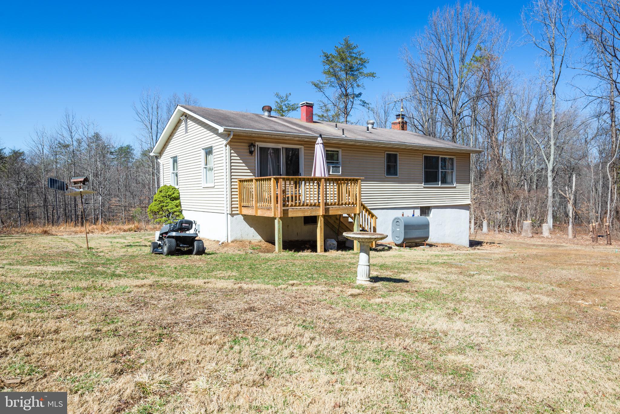 3603 Muddy Creek Road Edgewater, MD 21037 - Photo 4 of 20 a front view of a house with a yard