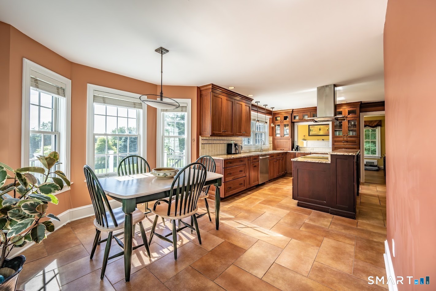 35 Anderson Lane Durham, CT 06422 - Photo 6 of 25 Bright breakfast area surrounded by windows flows seamlessly into the custom gourmet kitchen, creating an inviting space for everyday dining and entertaining.