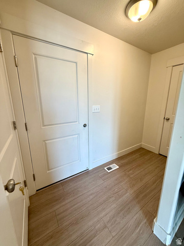 1823 South Longview Road Santaquin, UT 84655 - Photo 24 of 69 Entryway featuring wood-finish flooring, white paneled doors, and light-toned walls