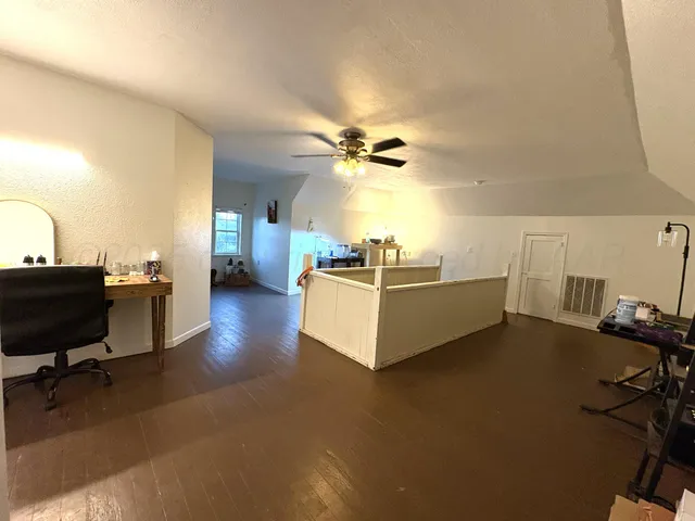 a view of a living room and bathroom