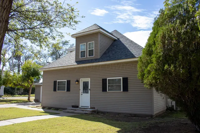 a front view of a house with garage
