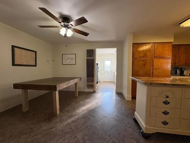 a kitchen with a stove a refrigerator and a sink