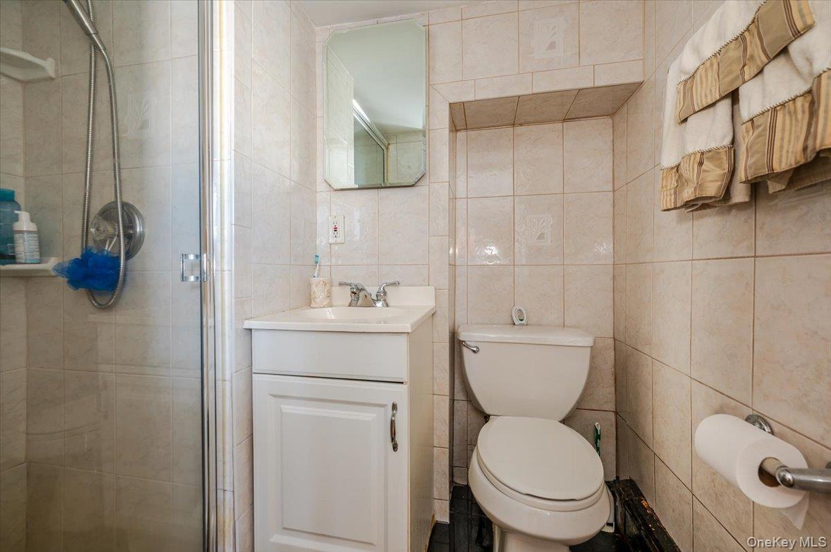 22 Cheshire Road Inwood, NY 11096 - Photo 17 of 25 a bathroom with a toilet and a sink