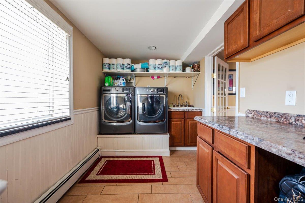 22 Cheshire Road Inwood, NY 11096 - Photo 18 of 25 a room with stainless steel appliances granite countertop a sink and cabinets
