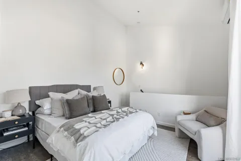 a bedroom with a bed and cabinets