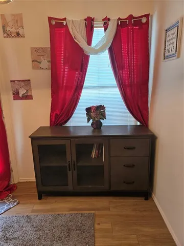 a view of a hallway with front door