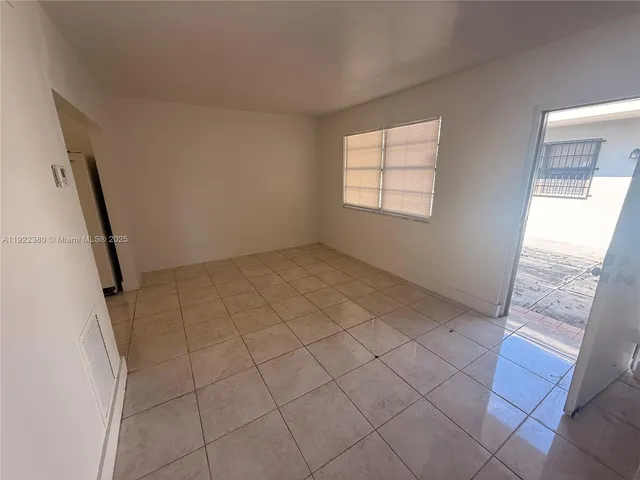 a white toilet sitting next to a bath tub shower