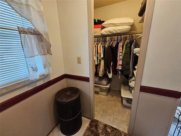 a bathroom with a sink and mirror with toilet