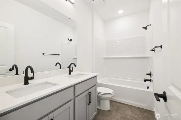 a bathroom with a sink a toilet and a tub