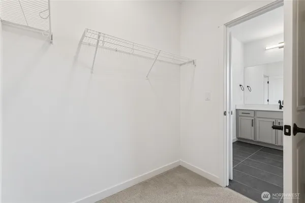 a view of a room with a barbeque and white walls