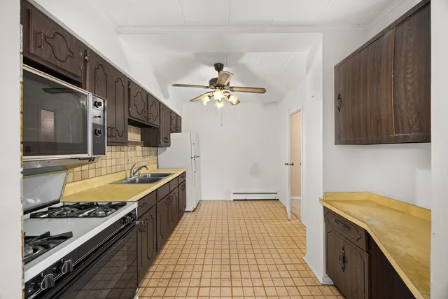 a kitchen with a stove and a sink