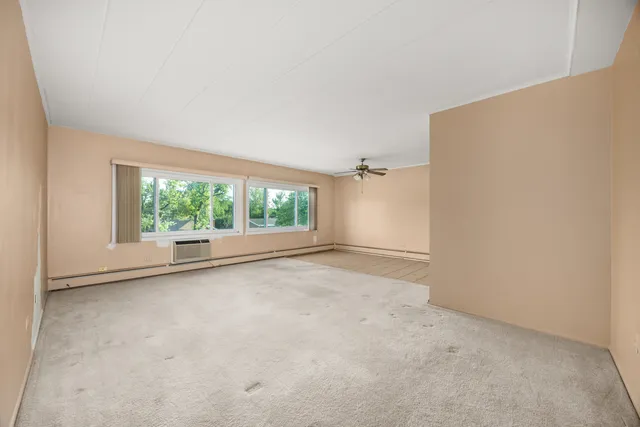 an empty room with a large window