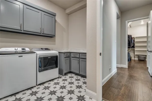 a view of a kitchen with electric appliances