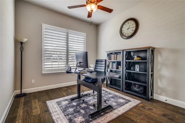 a view of a work space with furniture and a window