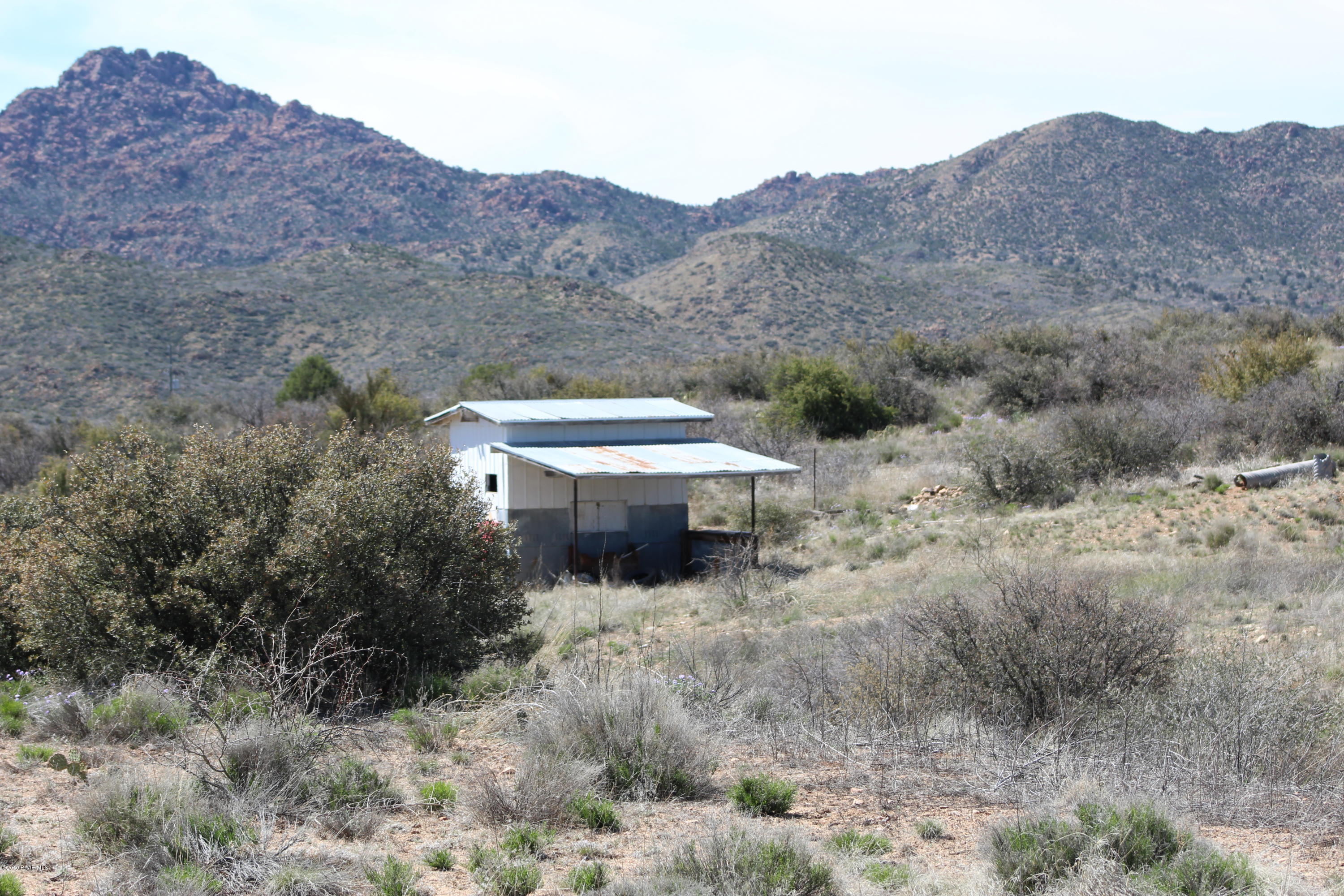 6850 Windmill Road Skull Valley, AZ 86338 - Photo 20 of 23 Shed with mountains behind