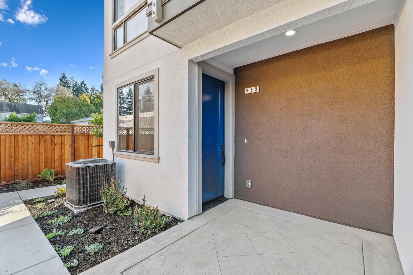 955 Woodside Road Redwood City, CA 94061 - Photo 5 of 46 a view of potted plants in front of a door