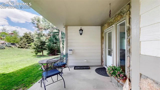 a backyard of a house with outdoor seating