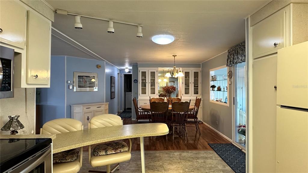 5619 Bayshore Road, Unit 163 Palmetto, FL 34221 - Photo 12 of 44 a view of a dining room with furniture
