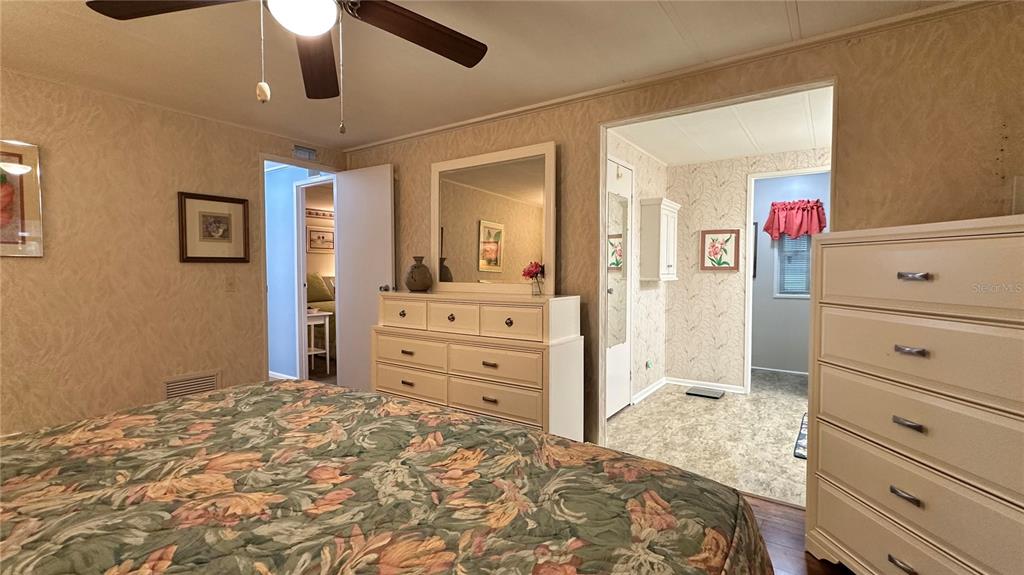 5619 Bayshore Road, Unit 163 Palmetto, FL 34221 - Photo 19 of 44 a bedroom with a dresser and a dresser