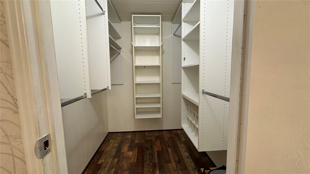 5619 Bayshore Road, Unit 163 Palmetto, FL 34221 - Photo 20 of 44 a view of walk in closet with empty racks