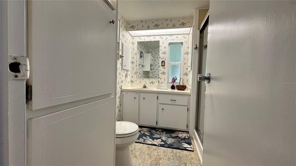 5619 Bayshore Road, Unit 163 Palmetto, FL 34221 - Photo 27 of 44 a bathroom with a sink toilet and shower
